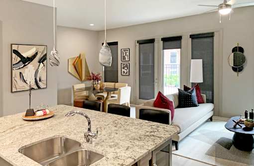 Spacious open concept luxury apartment with luxury finishes and granite countertops at Xenia Apartments in Golden Valley, Minnesota