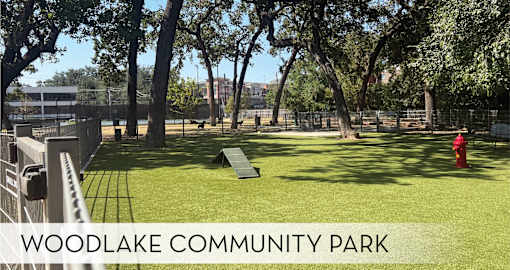 A park with a playground and a fire hydrant.