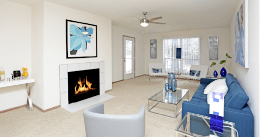 Apartments in central Lincoln Nebraska with spacious living room, spacious floor plan, huge living room, and woodburning fireplace at Tanglewood Apartments