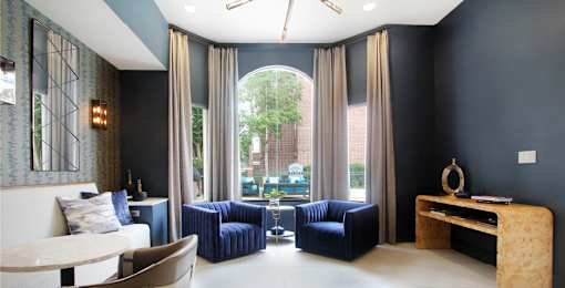 Luxury resident lounge space with free wi-fi at Tuscany Apartments in Houston.