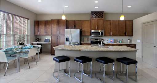 Luxury apartments with spacious kitchen, granite countertops, stainless steel appliances, built-in wine rack, kitchen island, front-loading washer and dryer and porcelain tile floor at Bellemeade Apartments in west Des Moines