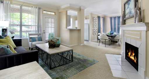 Luxury apartments with spacious open floor plan, woodburning fireplace, and oversized windows at Saddlebrook apartments in Urbandale, Iowa