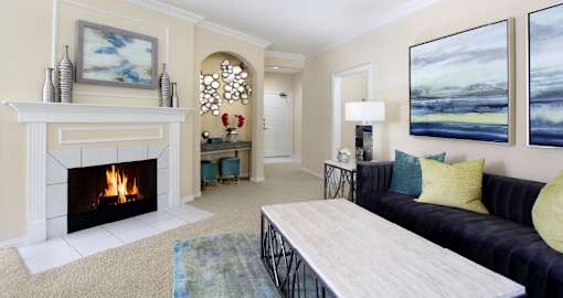 Luxury apartments with spacious open floor plan, woodburning fireplace, and oversized windows at Saddlebrook apartments in Urbandale, Iowa