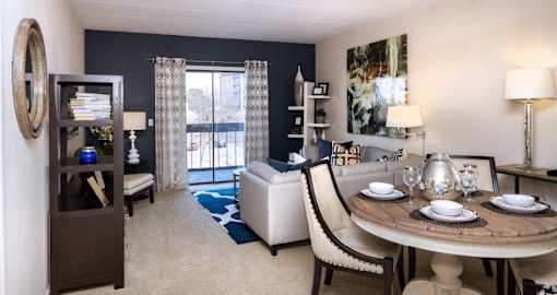 Spacious living room with colored feature wall at Embassy Park Apartments in Omaha, Nebraska