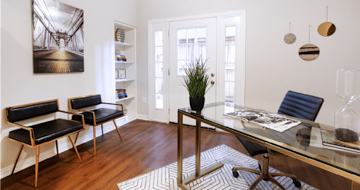 Huge office space, spacious den with built-in shelves, hardwood floors, and private backyard patios at Tuscany Row Townhomes in Houston.