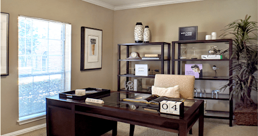 Gated apartment community near the Galleria with den or office space with wet bar at The Dorchester Apartments in Houston.