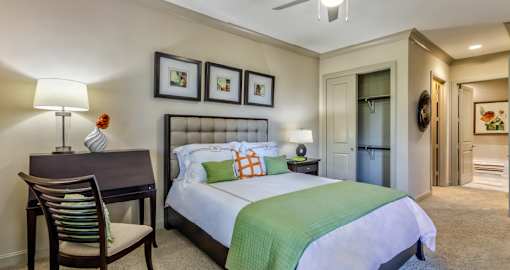 Luxury apartments with master bedroom to fit a king size bed, attached master bathroom and walk-in closet at Villa Piana Apartments in Dallas