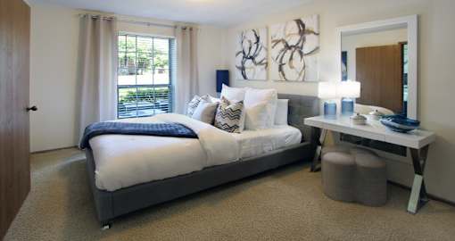 Spacious master bedroom with attached walk-in closet and master bathroom at Tanglewood Apartments in Lincoln, Nebraska