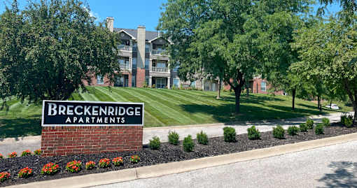 Luxury apartments in southwest Omaha with lush landscaping, mature trees, park-like setting