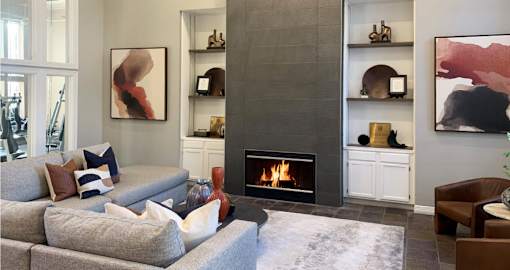 a living room with a fireplace and a couch
