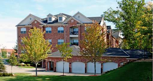 Luxury apartments with red brick exterior, garages, and scenic views in Minnetonka, Minnesota