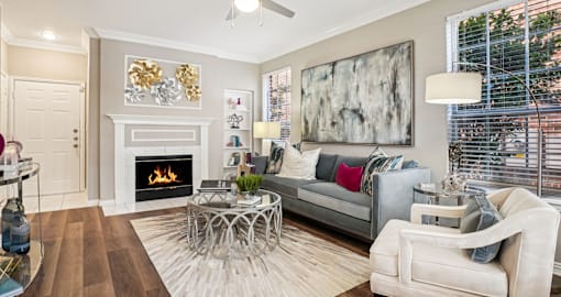 Luxury apartments with wood-burning fireplace, built-in bookshelves, and oversized windows at The Saxony Apartments