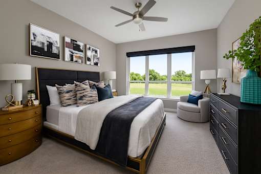 Spacious bedroom with 11-foot ceilings and walk-in closet at Le Palais Apartments in Houston.