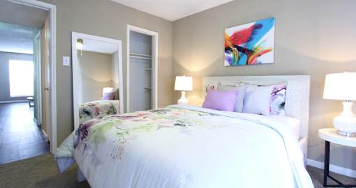 Spacious bedroom with ceiling fan and walk-in closet at Briarwood Apartments in Houston.