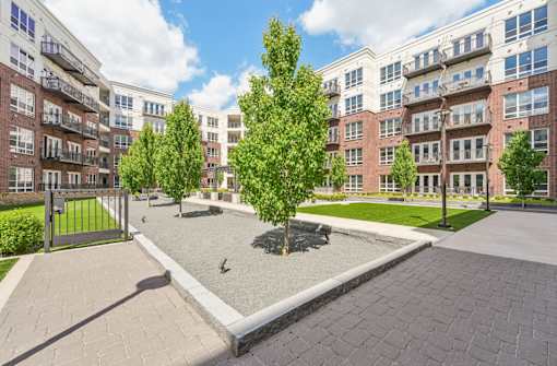 Luxury apartments with huge courtyard with lush landscaping and open green space at Xenia Apartments in Golden Valley Minnesota