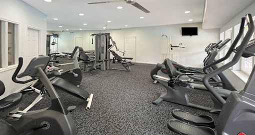 Fitness center with cardio and weight lifting equipment at Breckenridge Apartments in Omaha, Nebraska