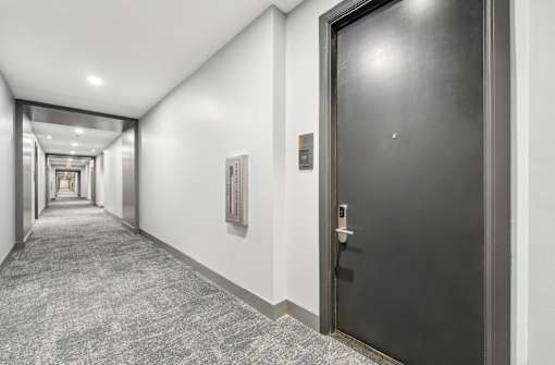 Front doors with digital locks, hallway area at Xenia Apartments in Golden Valley Minnesota