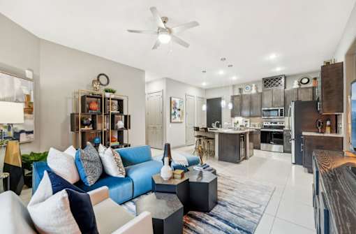 Spacious luxury apartments with porcelain tile floors, dark wood cabinets, and granite countertops at Xenia Apartments in Golden Valley, Minnesota