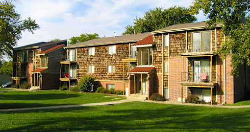 Apartments with scenic views, lush landscaping, park-like setting, and lots of trees at Inwood Apartments in La Vista, Nebraska