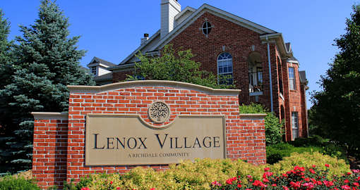 Luxury apartments located at 70th and Pioneers Blvd with red brick exterior and scenic views
