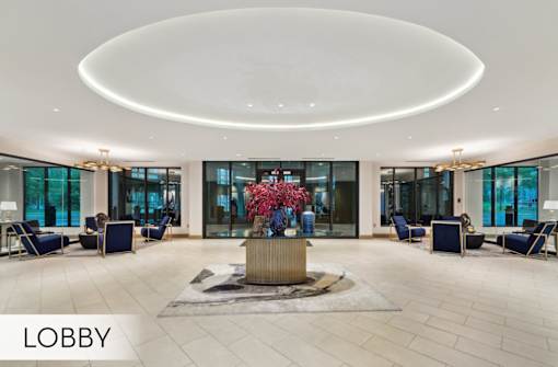 Spacious open-concept lobby with luxury finishes and seating areas at Xenia Apartments in Golden Valley Minnesota