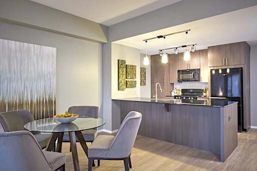 a modern kitchen and dining room.