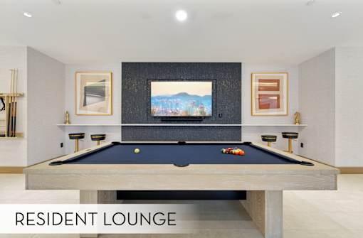 Modern pool table, resident game room, luxury resident lounge at Xenia Apartments in Golden Valley Minnesota