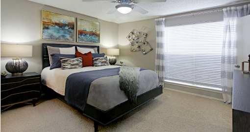 Spacious bedroom that can fit a king size bed with walk-in closet and attached bathroom at Preston Village Apartments in north Dallas