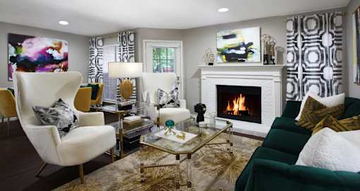 Spacious apartments with wood plank floors, woodburning fireplace, French door, and oversized windows at Preston Village Apartments