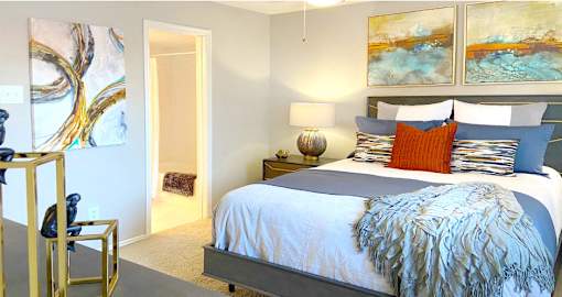 Spacious bedroom that can fit a king size bed with walk-in closet and attached bathroom at Preston Village Apartments in north Dallas