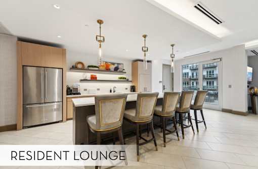 Luxury community kitchen modern common space in the great room resident lounge at Xenia Apartments in Golden Valley Minnesota