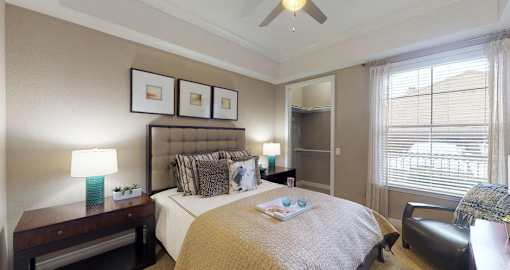 Spacious master bedroom with attached walk-in closet and master bathroom at RidgeGate Apartments in Minnetonka, Minnesota