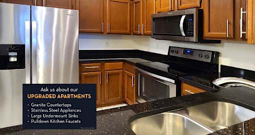 Spacious kitchen with granite countertops, stainless steel appliances and custom home cabinetry.