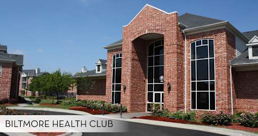 A red brick building with the words Biltmore Health Club on it.