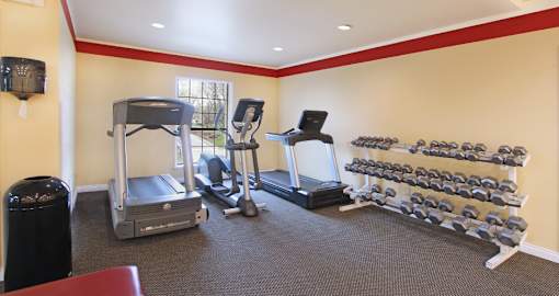 Fitness center with cardio equipment and weights at the Vanderbilt Apartments in Omaha, Nebraska
