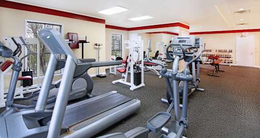 Fitness center with fitness equipment, cardio equipment, and weights at the Vanderbilt Apartments in Omaha, Nebraska