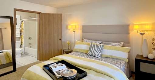 Spacious bedroom with walk-in closet and attached bathroom at Tanglewood Apartments in Lincoln Nebraska