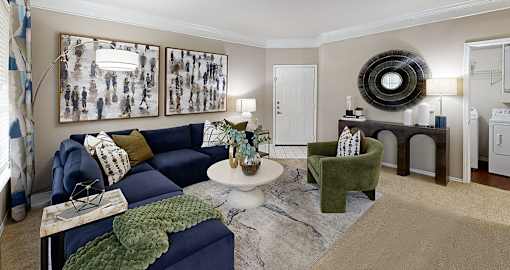 Spacious living room with crown molding and oversized windows at Village on the Parkway Apartments in Houston, Texas