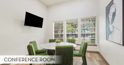 Resident conference room space in the clubhouse at Village on the Parkway Apartments in Houston Texas