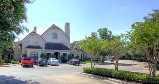 Gated community in Houston with attached and detached garages, covered parking, 24-hour fitness center with showers and lockers, beautiful landscaping and scenic views.