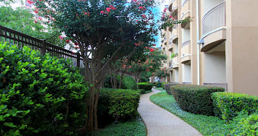 Luxury apartments next to the Galleria in Dallas with beautiful landscaping and spacious balconies at Villa Piana Apartments in Dallas