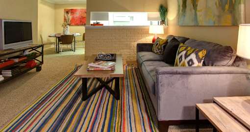 Spacious one and two bedroom floor plans with white brick accent walls at Waters of Winrock Apartments in Houston.