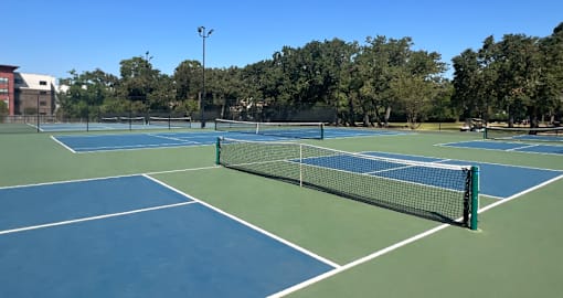 Tennis Courts at Woodlake Community Park near Woodlake Oaks Apartments, Houston Texas