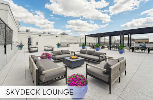 Luxury Skydeck lounge with firepit and comfortable seating, rooftop lounge space at Xenia Apartments in Golden Valley, Minnesota