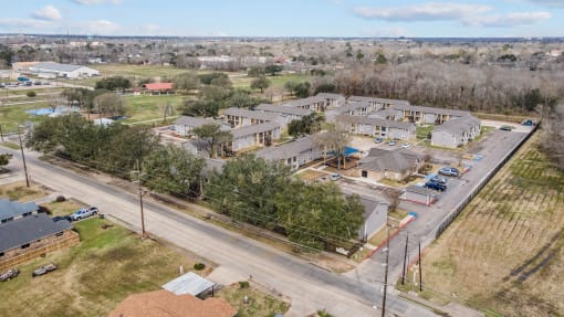 an aerial view of a neighborhood of houses and a road