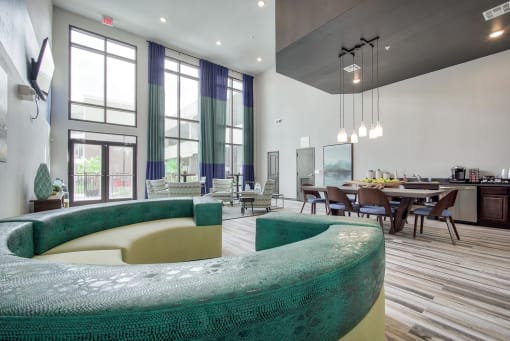 a room with a large window and a table with chairs