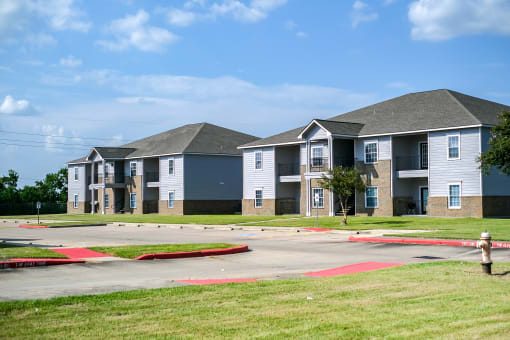 a row of townhomes with a fire hydrant in the foreground