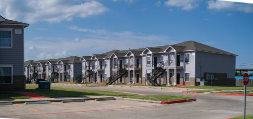 a row of condominiums on a street