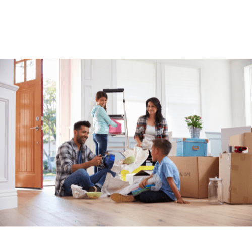 A family is unpacking boxes in their new home.