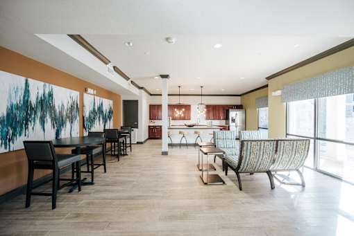 A large room with a long table and chairs.